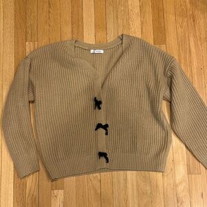 Cozy Tan Sweater with Black Bow Accents
